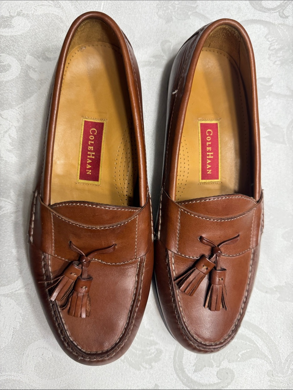 EUC Cole Haan brown leather  tassel loafer. Size 9 1/2.